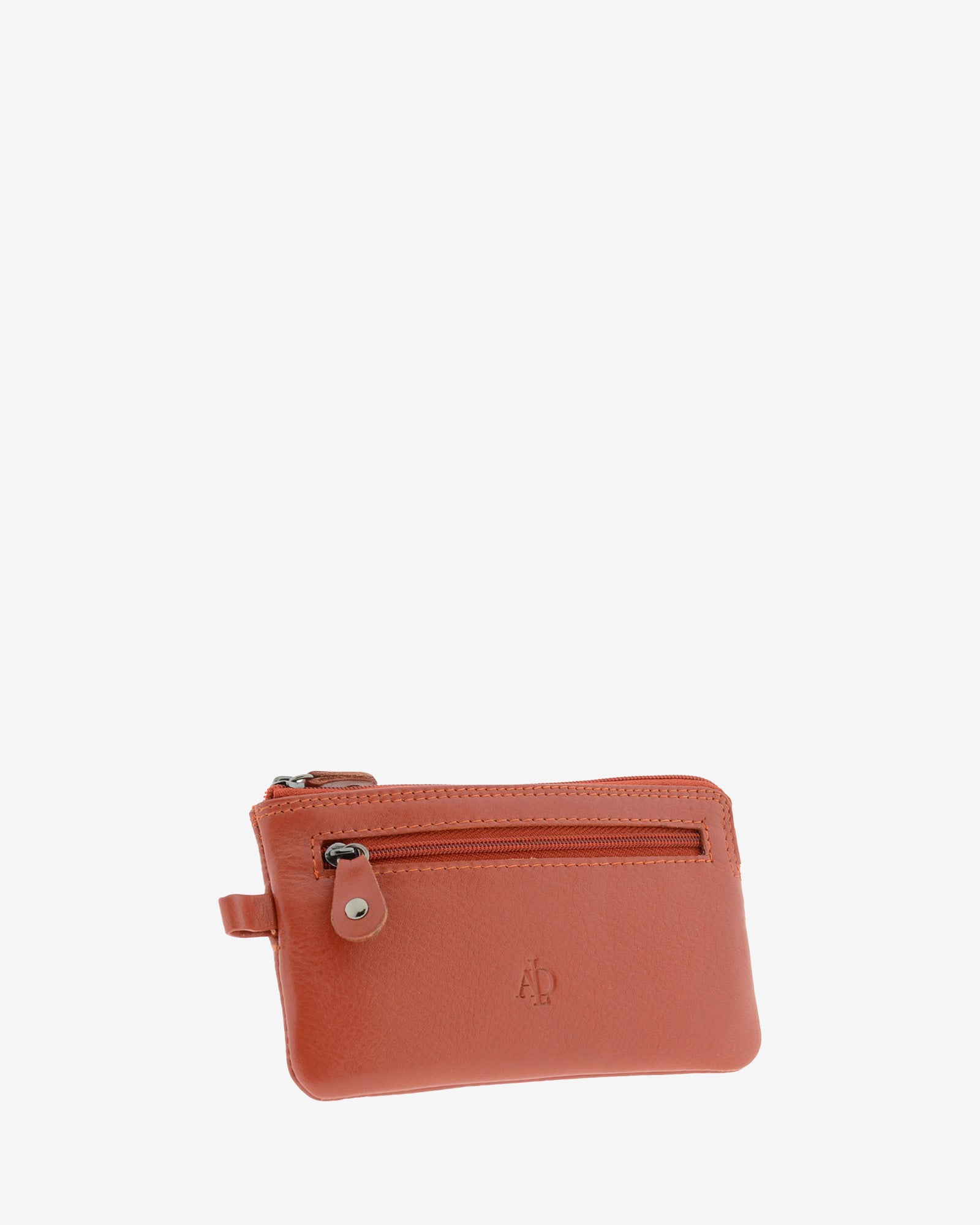 Monedero fino 8079 en color teja, vista tres cuartos frontal con bolsillo exterior de cremallera.