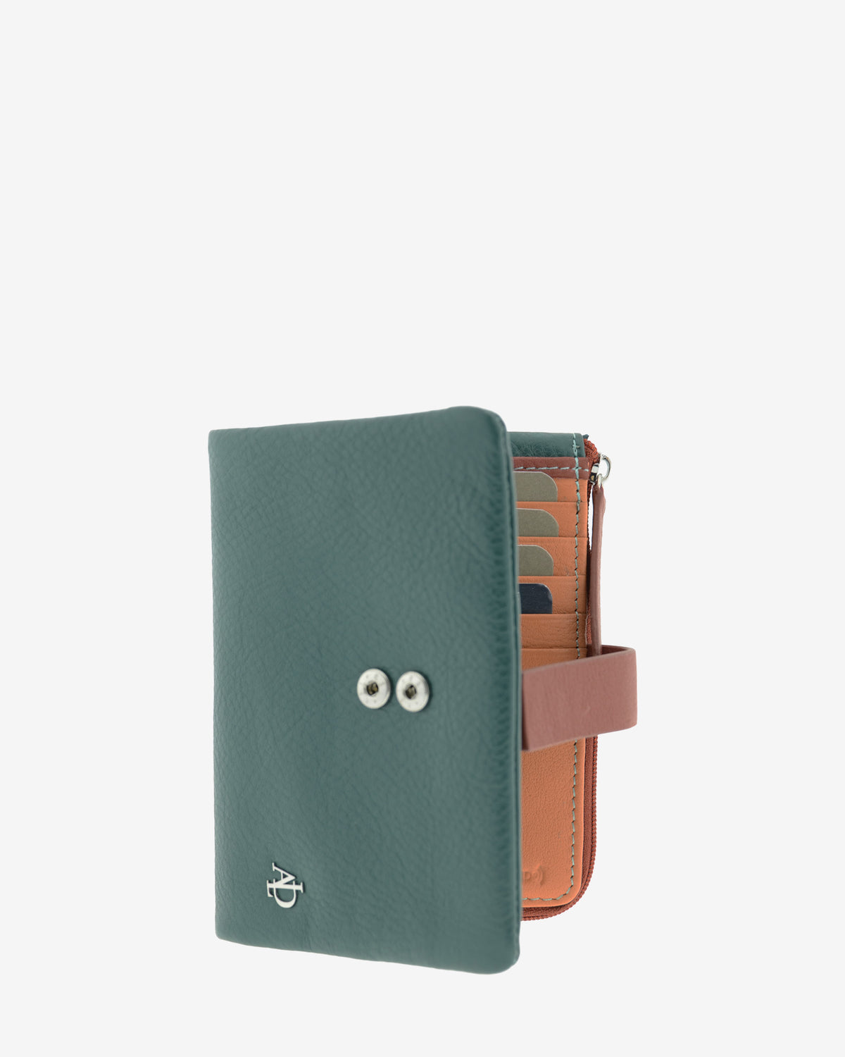 Interior de la cartera pequeña de mujer Brisa en color Ocean Teal, abierto en tres cuartos. y parte interior parcialmente visible.