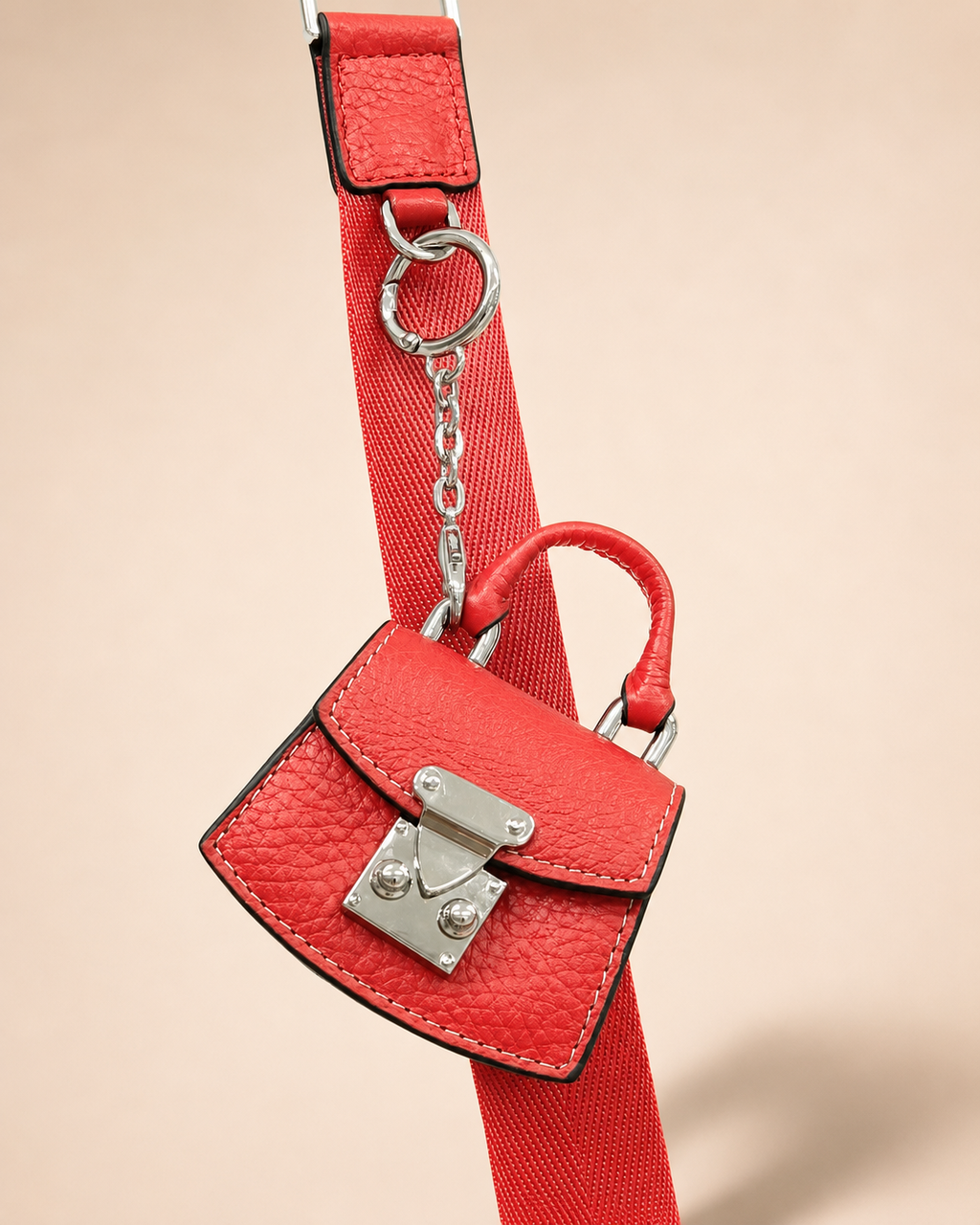 Charm para bolso con funda para auriculares Nexo 8099 amapola enganchado mediante cadena y anilla a una correa