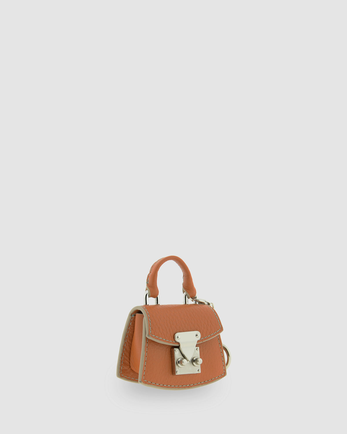 Charm para bolso con funda para auriculares Nexo 8099 miel, vista frontal en perspectiva con asa y cierre metálico