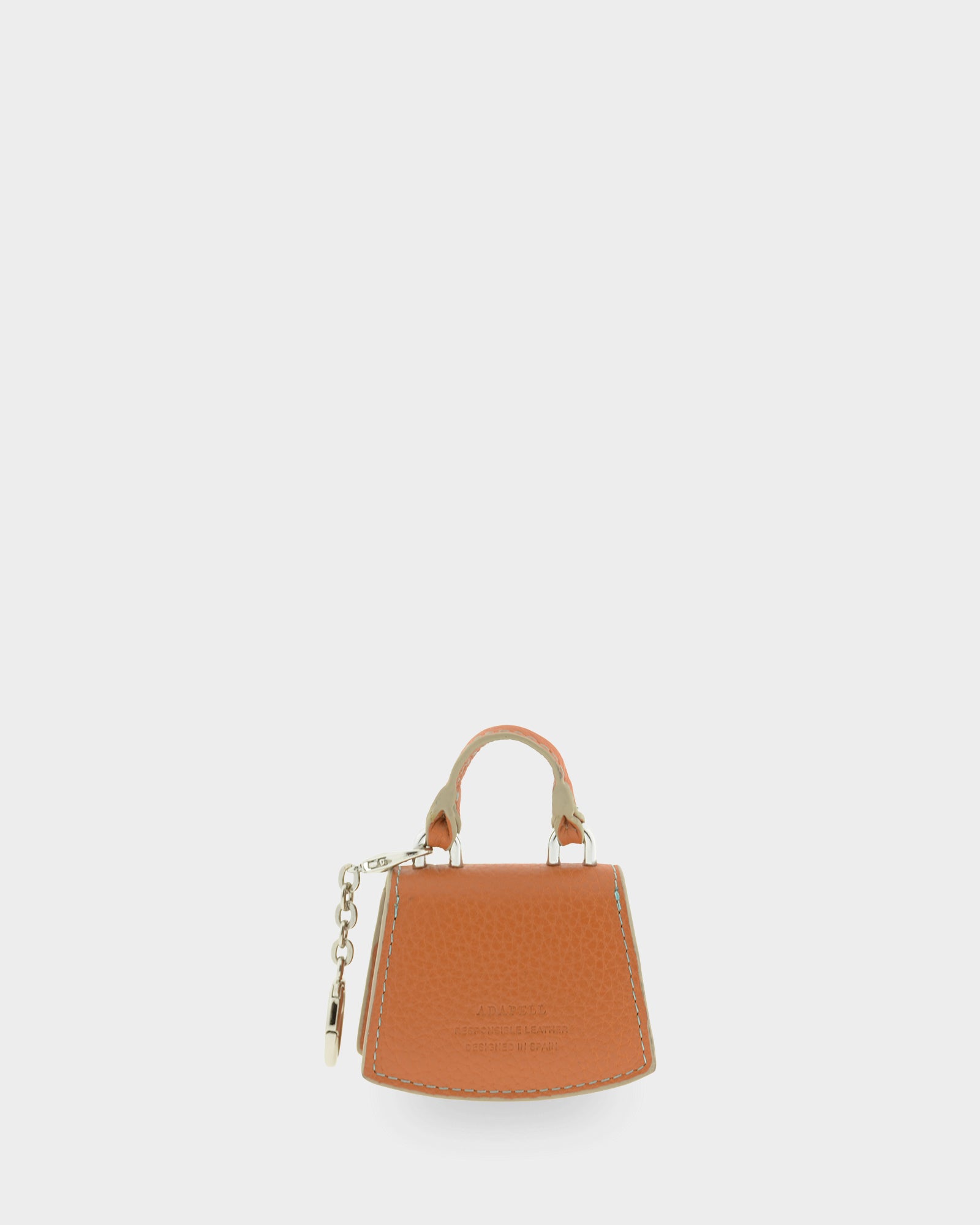 Charm para bolso con funda para auriculares Nexo 8099 miel, vista trasera con cadena y anilla