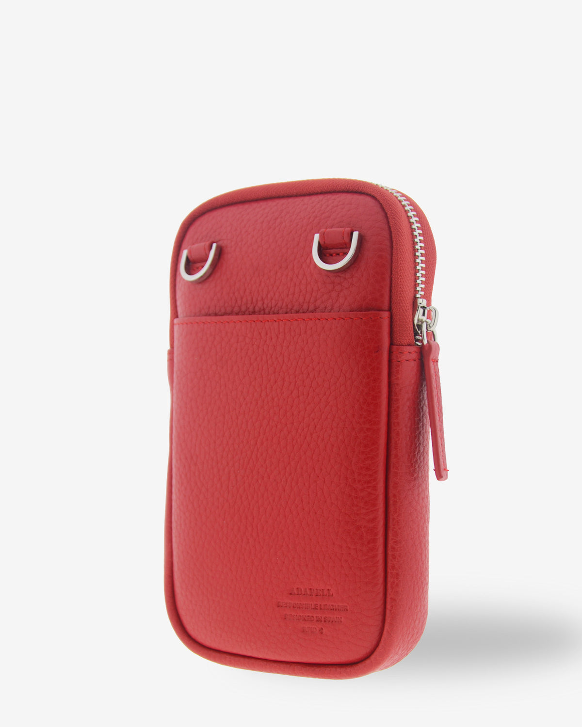 Bolso bandolera vertical Nexo en color amapola, vista tres cuartos trasera con bolsillo exterior, anillas para la bandolera y cierre de cremallera