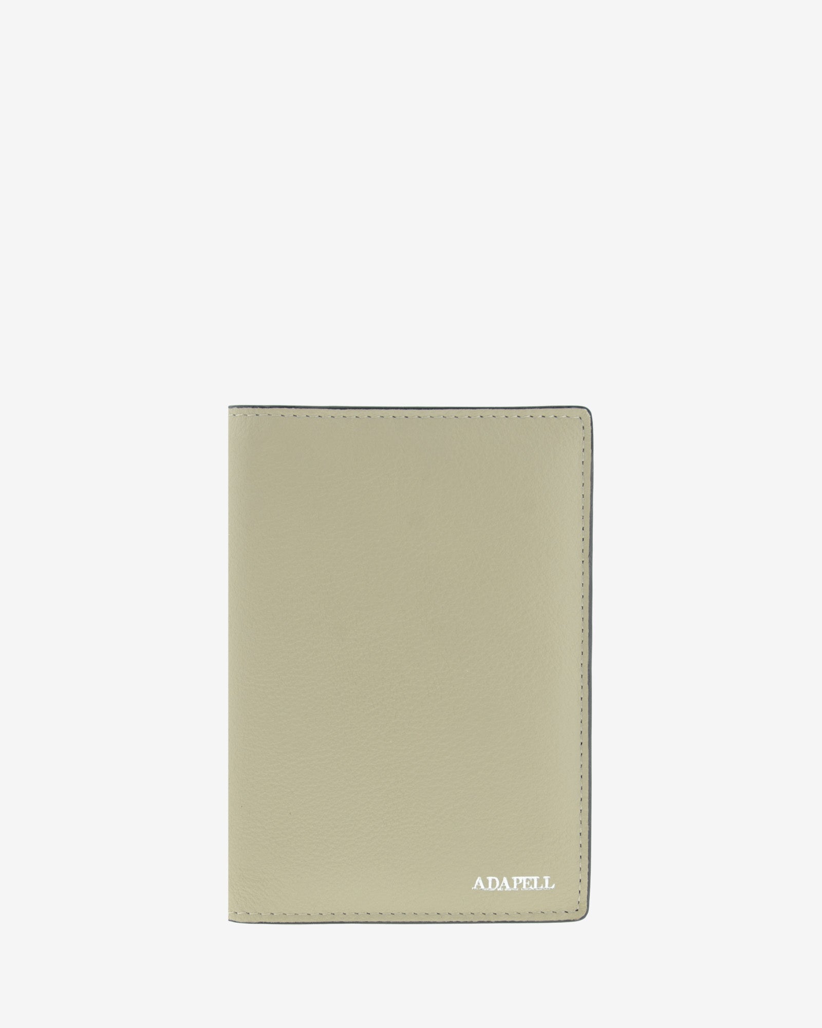 Funda pasaporte en piel auténtica muy suave de color ice stone y cantos en negro, ref. 8087-12, con protección RFID, y logo plateado Adapell, vista frontal