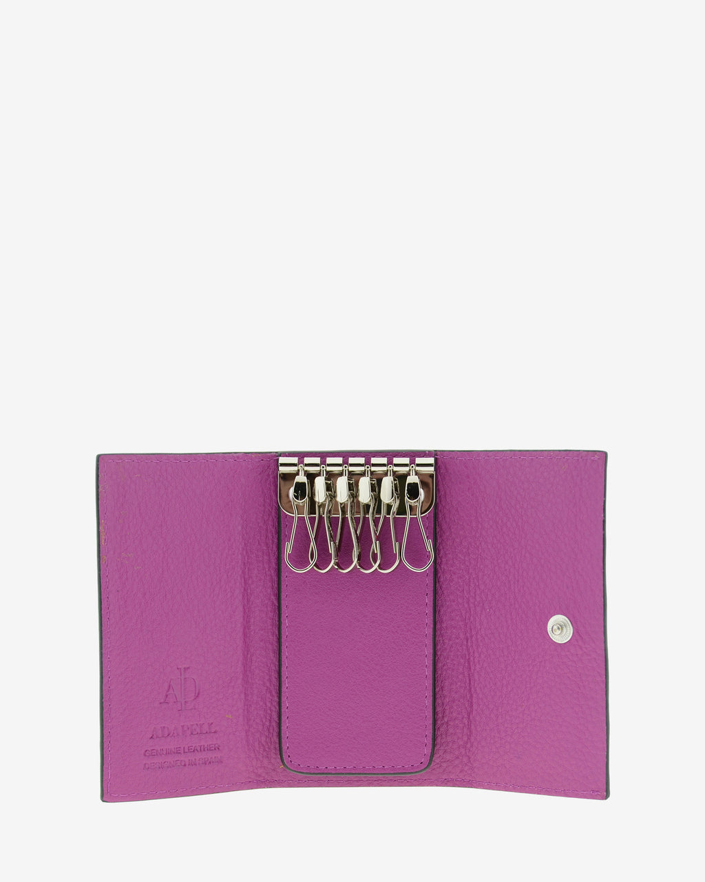 Llavero en piel auténtica de color lila y bordes en negro, con interior de piel, mosquetón para 6 llaves y exterior con compartimento para tarjeta, vista interior