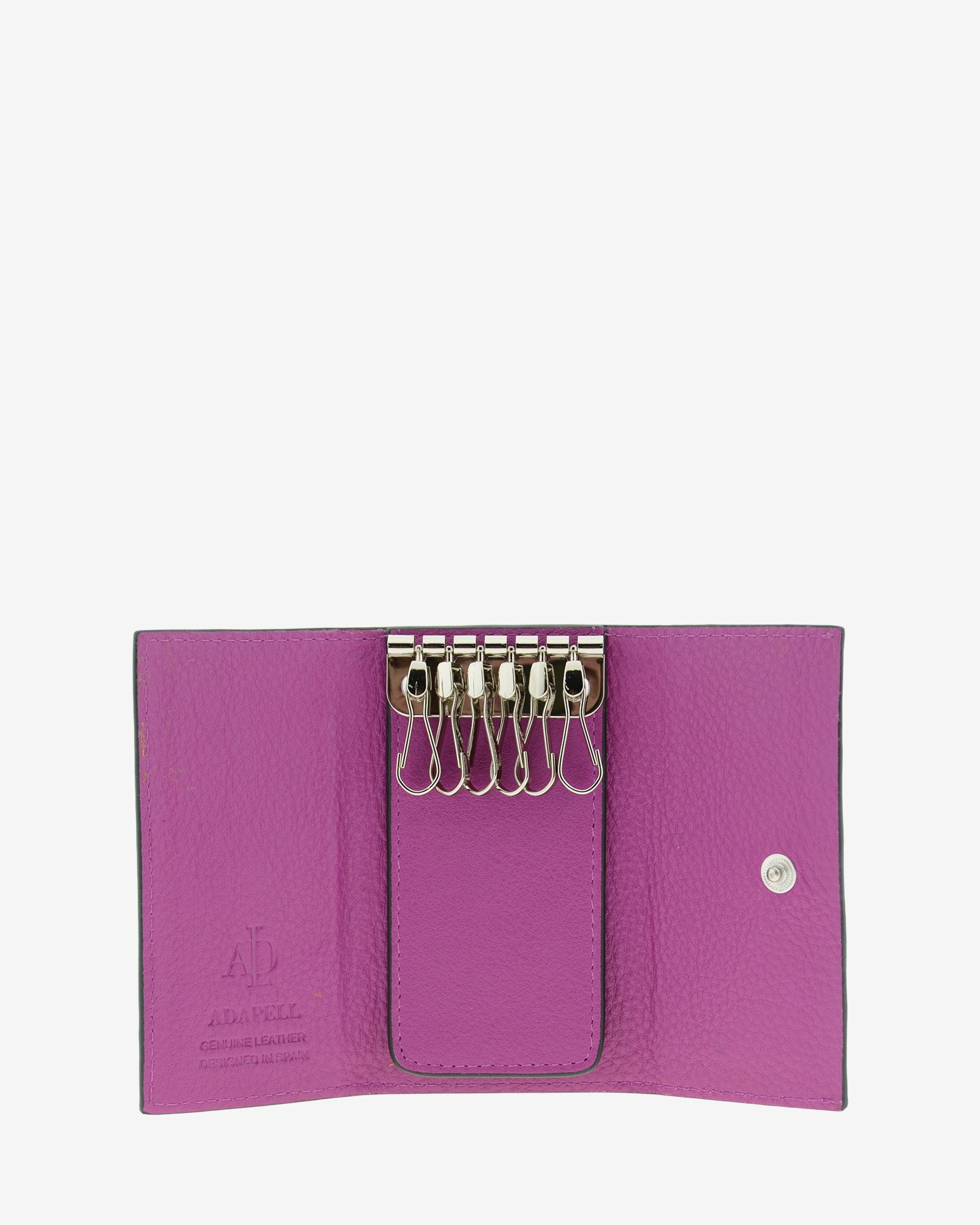 Llavero en piel auténtica de color lila y bordes en negro, con interior de piel, mosquetón para 6 llaves y exterior con compartimento para tarjeta, vista interior